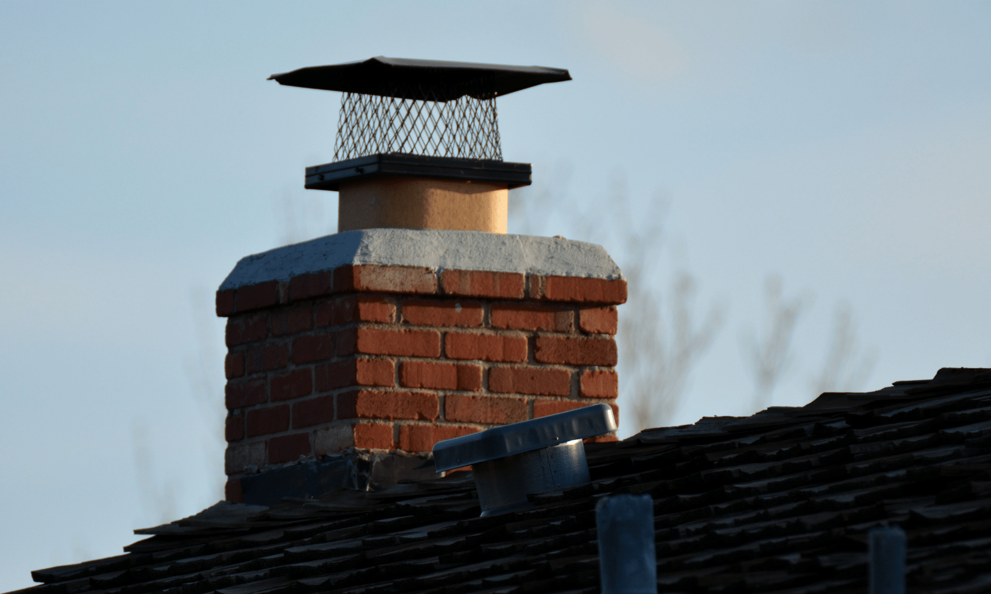 Snow Asheville, NC Fireplace Store chimney crown edited | Clean Sweep The Fireplace Shop